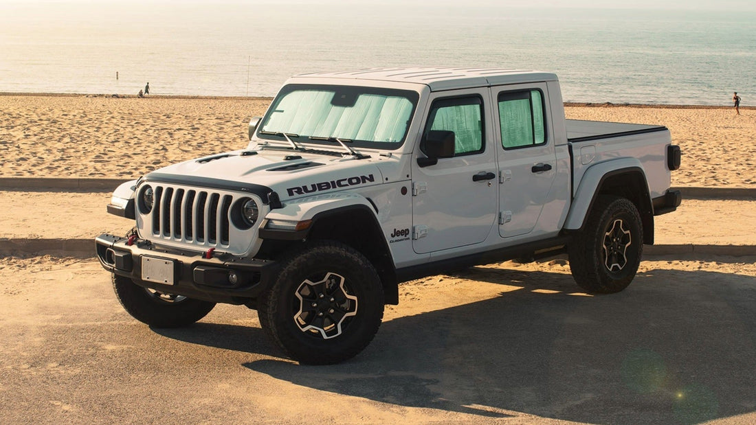 White Jeep Wrangler at the beach