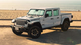 White Jeep Wrangler at the beach