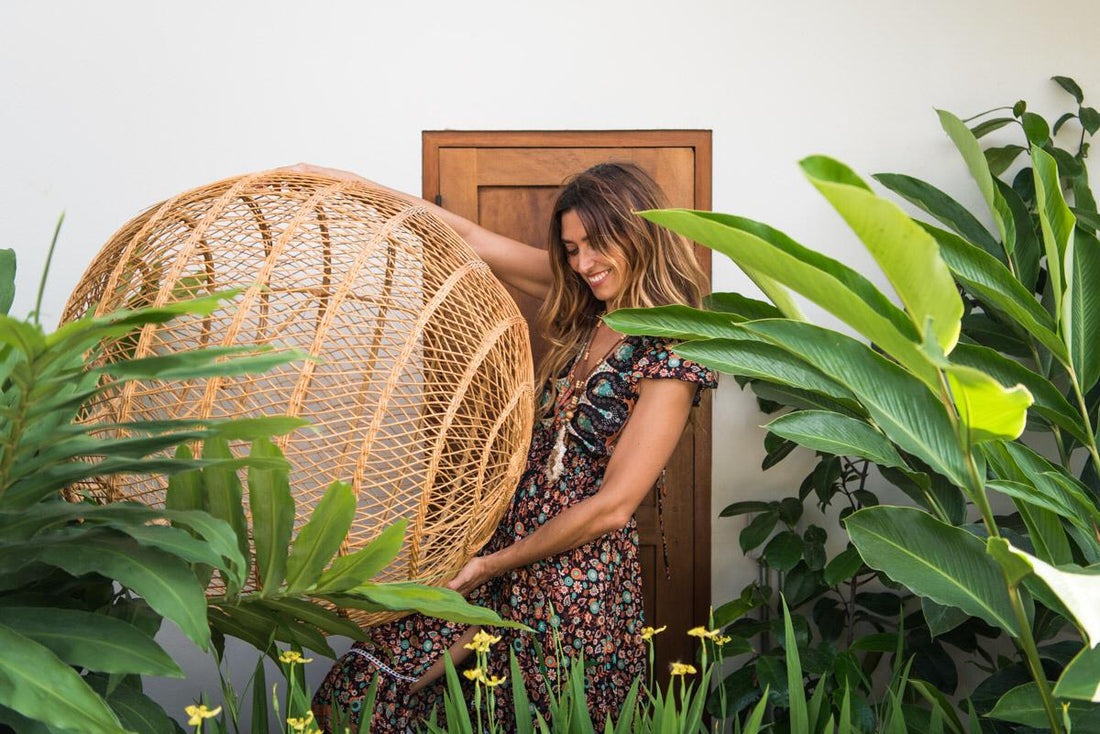 Woman holding ratan furniture
