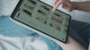 Person scrolling shop on an ipad
